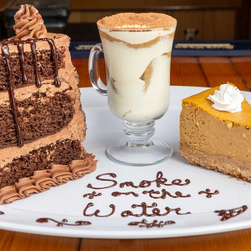 Homemade desserts plated with Smoke on the Water written in chocolate