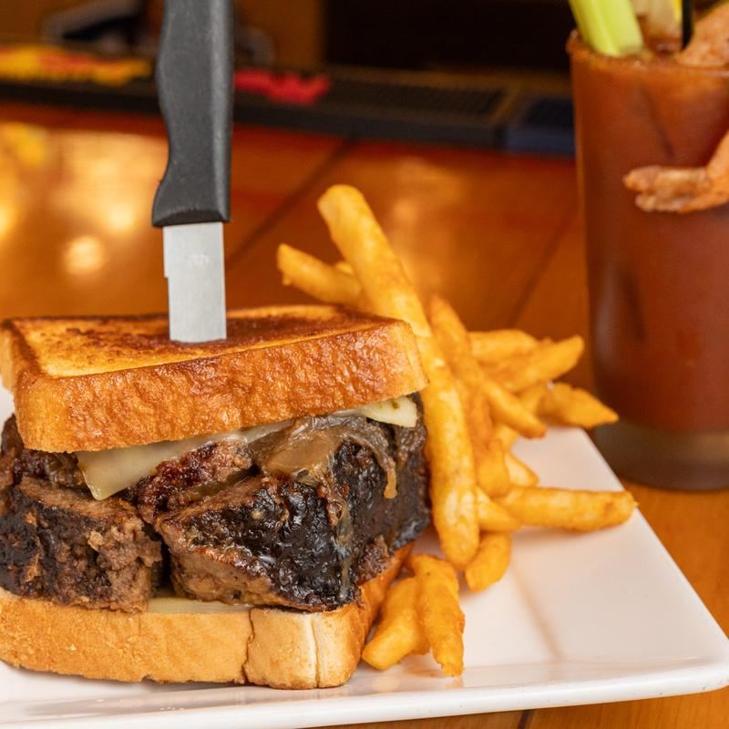Smoked meatloaf grilled cheese on Texas toast with fries