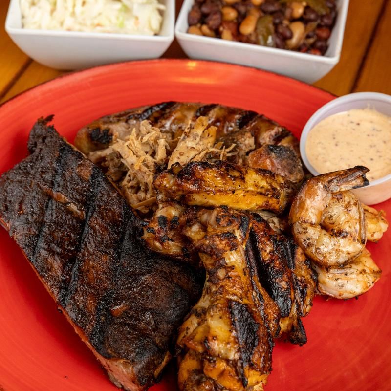 Ribs, smoked wings, shrimp and pulled pork with beans and slaw